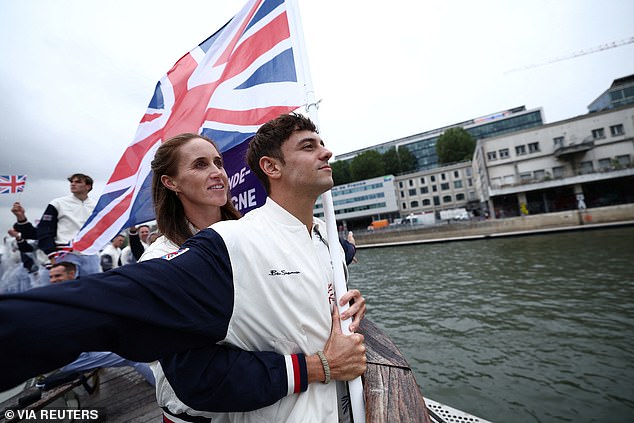 The rain didn't stop, but boats carried cheering athletes across the River Seine