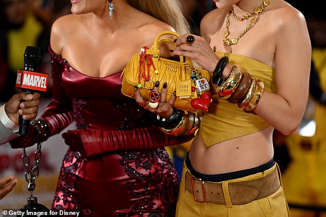 Blake shared a detailed look at their outfits; she's wearing Versace and Gigi is wearing Miu Miu