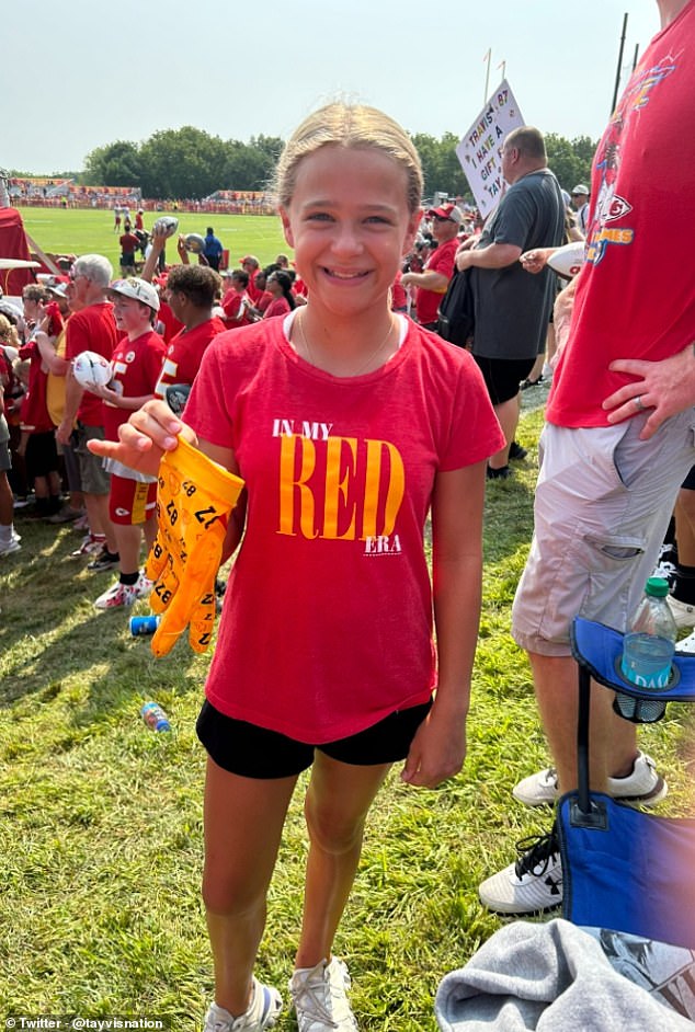 The young girl wore a Taylor Swift T-shirt and seemed happy to have caught Kelce's gloves