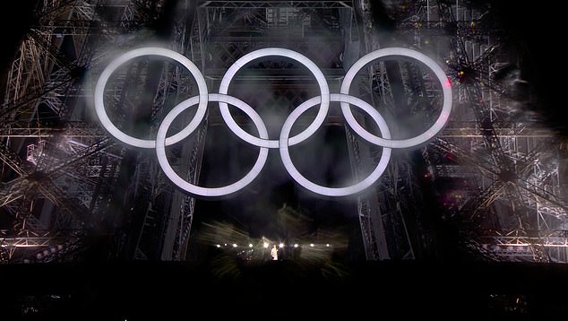 The Olympic rings lit up beneath the Eiffel Tower where Celine Dion performed at the opening ceremony