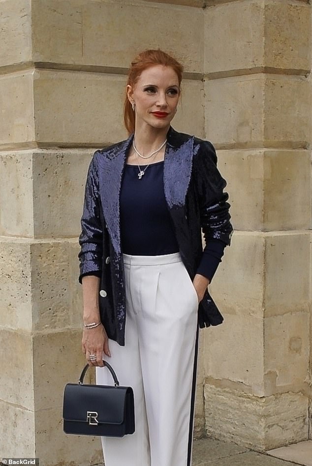 The 47-year-old Help star wore a stunning navy sequin blazer with a navy top and white high-waisted trousers with a navy tuxedo stripe down the sides of the legs