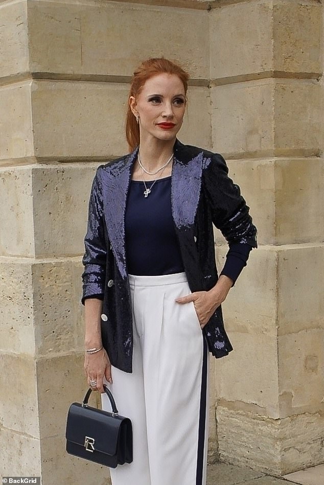 Jessica posed in front of an ornate gate and the marble facade of a building as the 2024 Summer Olympics kicked off in Paris