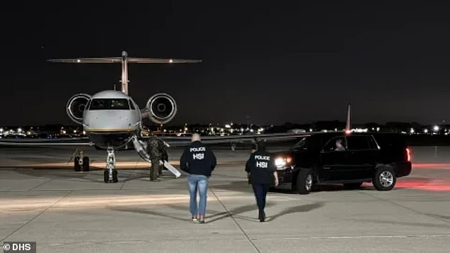 Federal agents from Homeland Security Investigations greet the plane carrying Sinaloa drug cartel bosses Ismael Zambada and Joaquin Guzman Lopez near El Paso, Texas Thursday