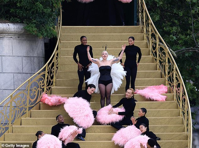 Before the lighting of the torch, several performances took place, including Lady Gaga singing Zizi Jeanmarie's Mon Truc En Plume on a golden staircase (seen above)