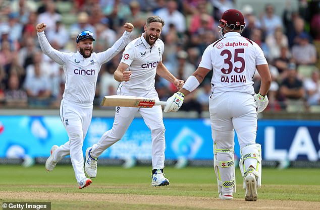 Chris Woakes (centre) also took three wickets on his home ground, in a solid opening session for the England bowlers