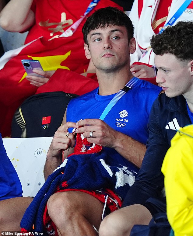 Tom enjoyed knitting as he watched the women's 3m springboard final at the swimming centre on Saturday, the first day of the Paris 2024 Olympic Games