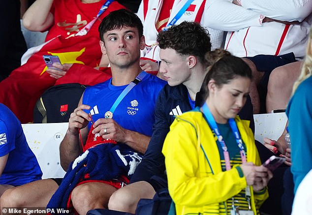 Tom Daley was spotted knitting in the crowd - as he did in Tokyo - but he was careful