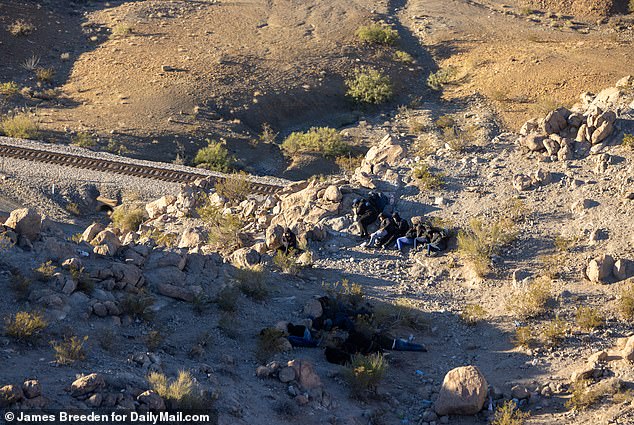 Migrants being smuggled into the US crouch to avoid being spotted by Border Patrol