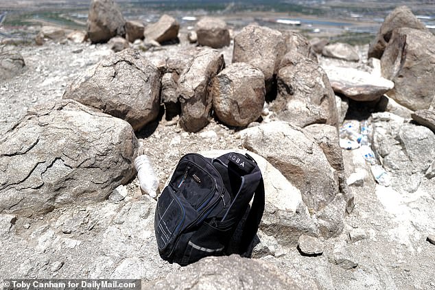 During a tour of Mount Cristo Rey with police, DailyMail.com heard someone running away as we approached. The person, probably a smuggler, left a backpack behind