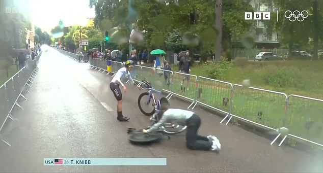 And soon she was followed by her mechanic who flew onto the road as he rushed to get the cyclist a new bike