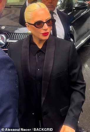 As always, she looked effortlessly stylish with her platinum blonde locks pulled back into a neat ponytail, and her red lipstick added a pop of color