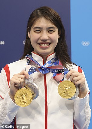 The Chinese swimmers (including Zhang Yufei, pictured, who claimed gold in Tokyo) were cleared after authorities acknowledged they had been infected by the same hotel kitchen