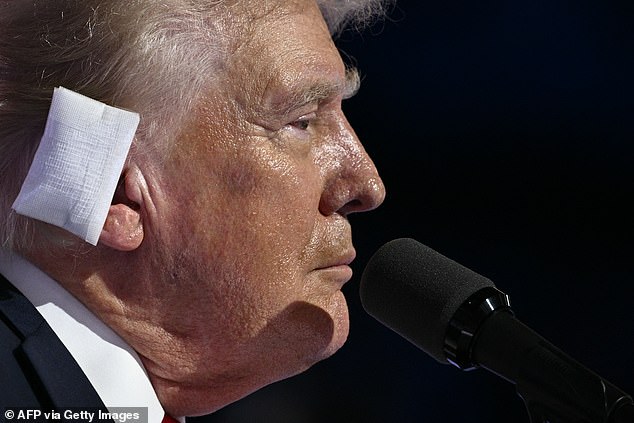 In the weeks following the shooting, Trump wore a large white bandage over his injured ear. He has since covered his ear with a band-aid. (Pictured: Trump on July 18 in Milwaukee, Wisconsin)