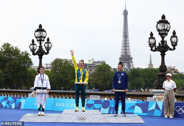 Dygert completed the course in 41:10.70, behind gold medalist Grace Brown of Australia (C)