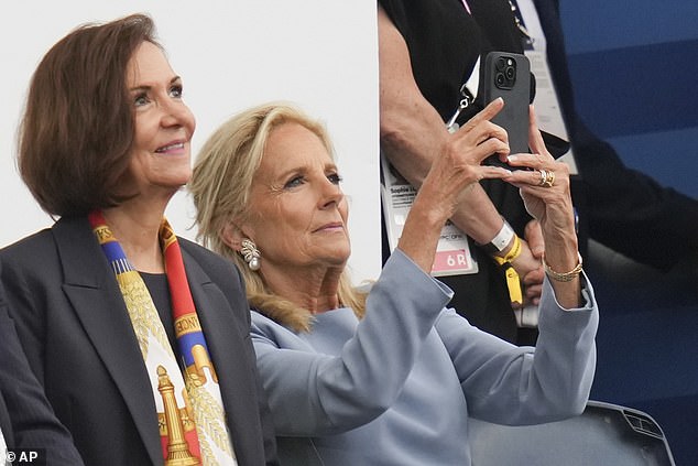 Jill Biden takes a photo during the Olympic Games opening ceremony