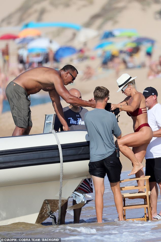 Besides walking on the beach, the couple also enjoyed a ride on Rodriguez's boat