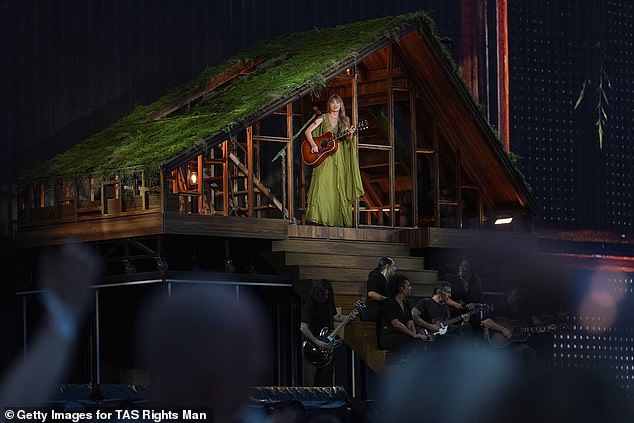 The singer then donned a green dress for her Evermore album