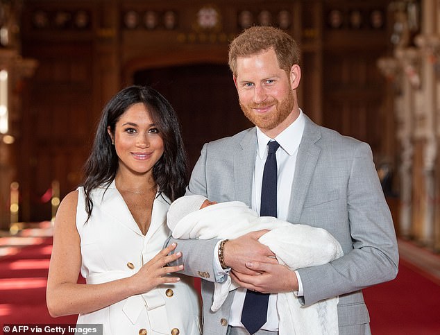 Prince Harry and Meghan with Archie in May 2019, when a newborn son