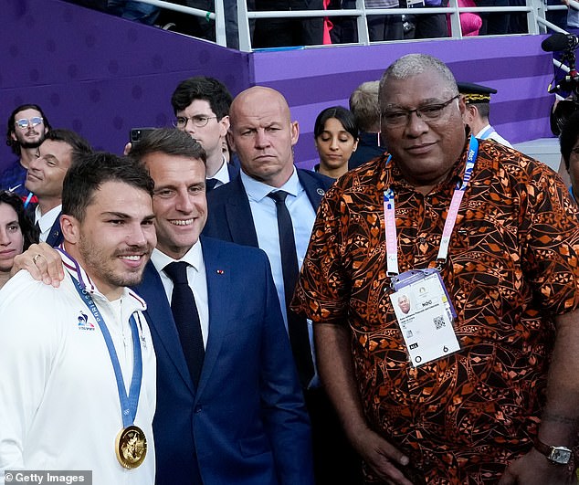 Dupont (left) also posed next to a smiling French President Emmanuel Macron (second from left) and Fiji President Ratu Wiliame Maivalili Katonivere (first from right).