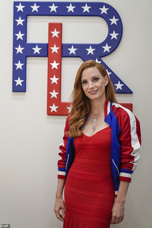 The Academy Award winner wore a Varsity jacket over her top, with the colors of the American flag on the sleeves, and tucked her auburn hair behind one ear