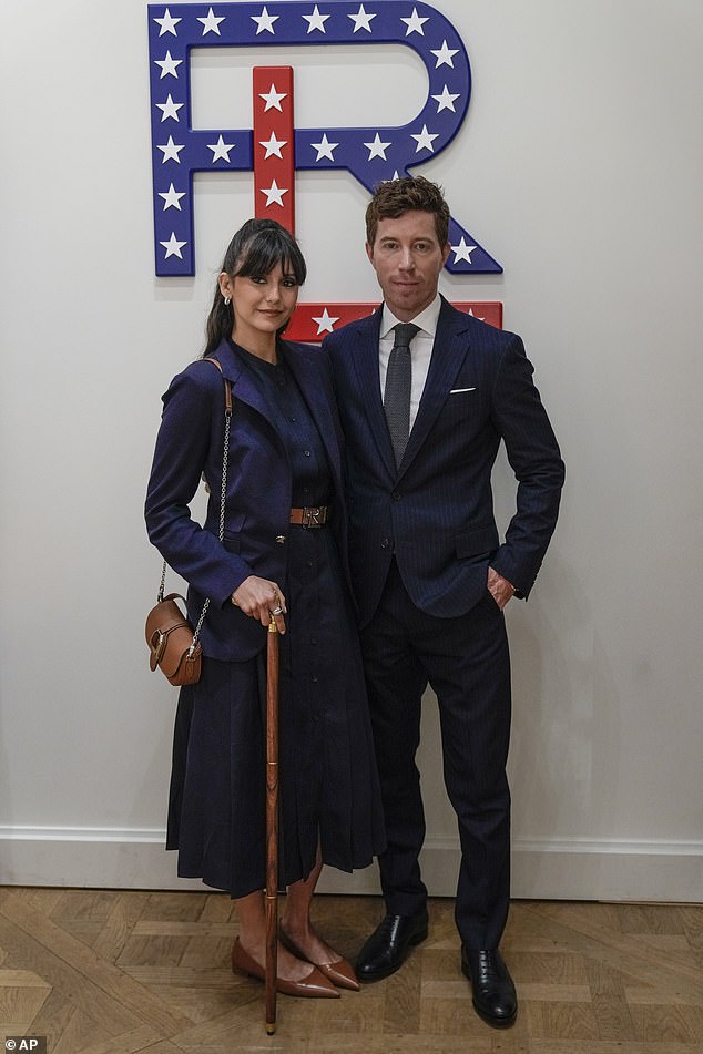 She was joined by her Olympian boyfriend Shaun White, a former professional snowboarder, 37, who matched his injured girlfriend's look with a navy suit, crisp white shirt and tie.