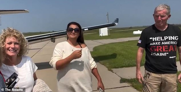 The tragic clip showed the family standing in front of the ill-fated jet before it crashed over a remote area of ​​northeastern Wyoming (pictured far right: pilot Larry Haynie)