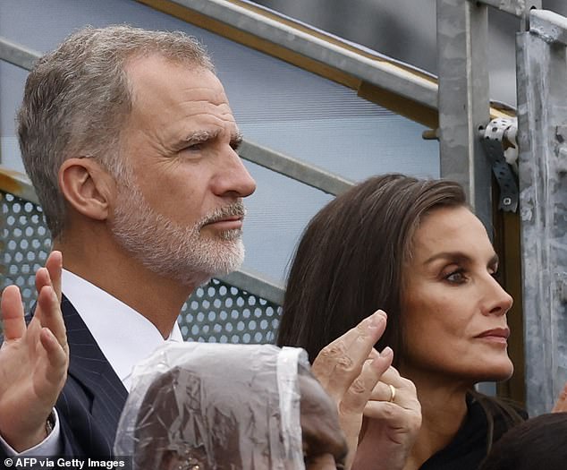 The deafening expressions on the faces of King Felipe (left) and Queen Letizia of Spain (right) betrayed a desire to escape to the Costas