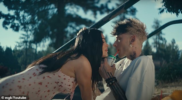 In the music video, the Transformers star is seen with a visible baby bump as she shares intimate moments with MGK, including him kissing and cradling her stomach