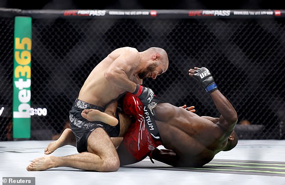 Mixed Martial Arts - UFC 304 - Manchester - Co-op Live, Manchester, Great Britain - July 28, 2024. Muhammad Mokaev fights against Manel Kape during UFC 304. REUTERS/John Sibley