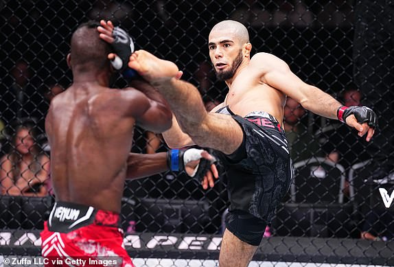 MANCHESTER, ENGLAND - JULY 27: (RL) Muhammad Mokaev of Russia kicks Manel Kape of Angola in a flyweight bout during the UFC 304 event at Co-op Live on July 27, 2024 in Manchester, England. (Photo by Chris Unger/Zuffa LLC via Getty Images)