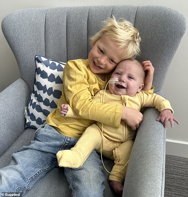 Rocco's father, Chris Kennewell, hopes his family can go home and spend Rocco's last bit of time together (pictured are Rocco and his big brother, Arlo)