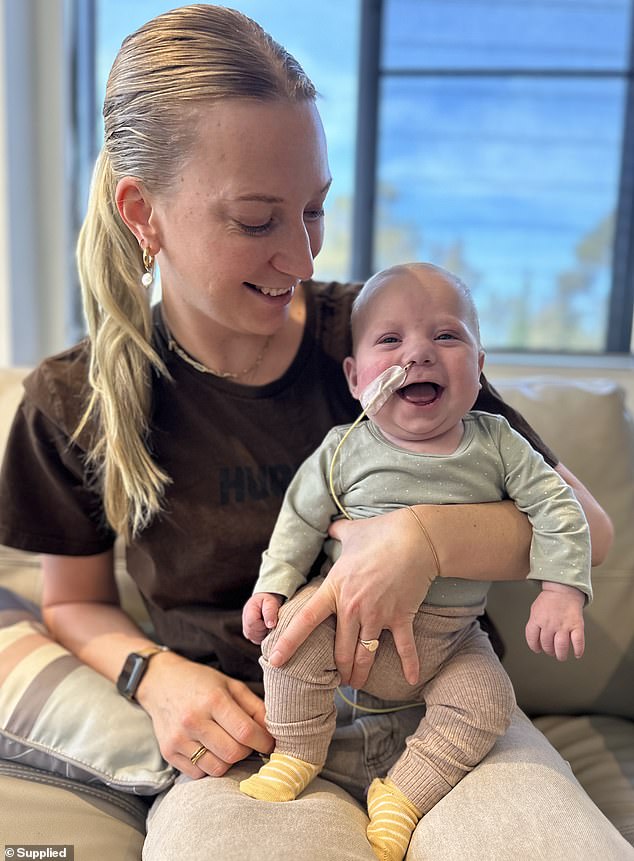 Rocco (pictured with his mother, Skye Kennewell) underwent the first of three planned surgeries, but is unable to undergo further treatment due to a side effect