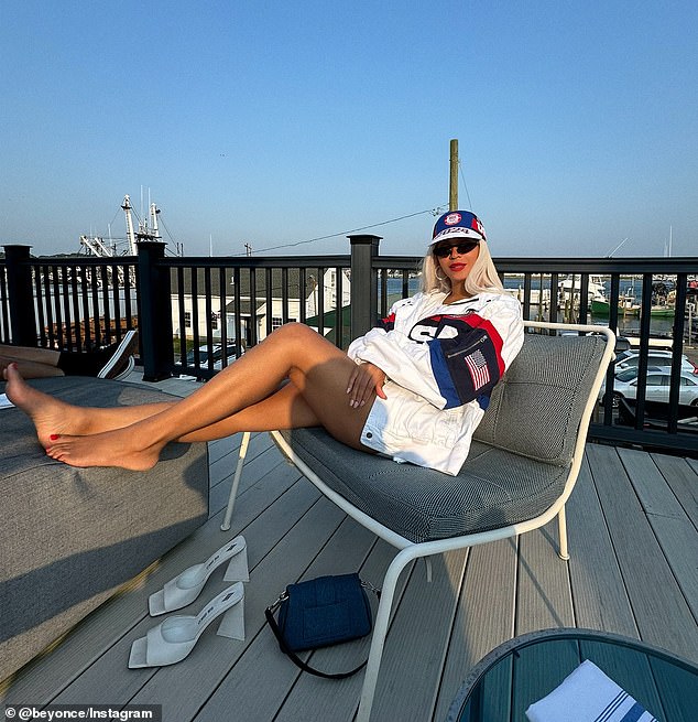 In another photo, the Grammy winner flashed a small smile as she enjoyed the summer weather while lying on a chair on a wooden deck