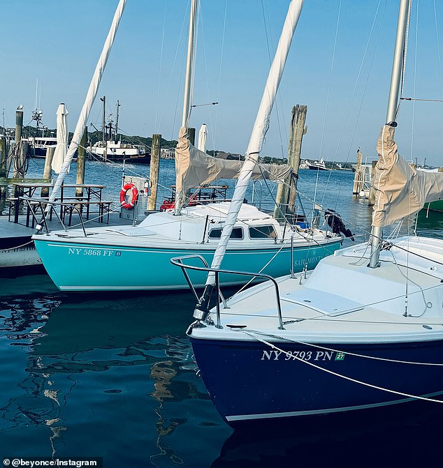 Another photo was taken showing two blue boats floating on the water in New York State Harbor.