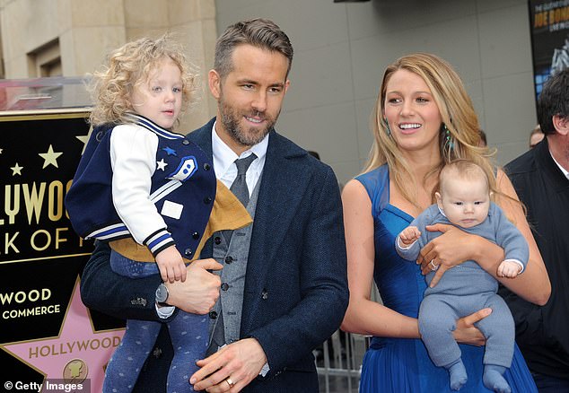 Ryan and Blake pictured with their daughters James and Inez on December 15, 2016 at his Hollywood Walk of Fame ceremony