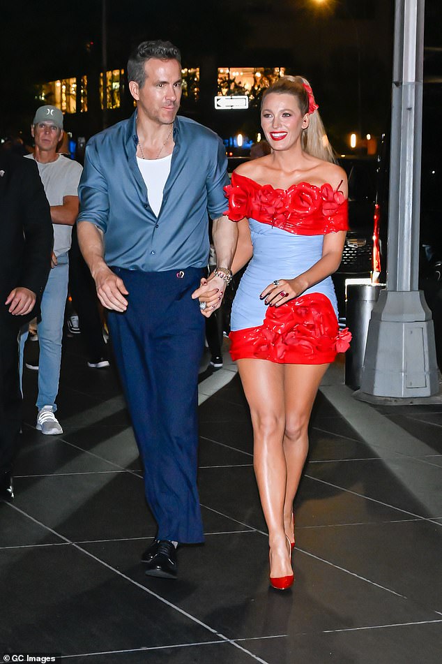 Blake looked gorgeous in a blue and red floral mini dress as he walked hand in hand with Ryan