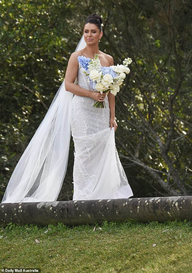 For the ceremony, Rhi looked every inch the blushing bride in a gorgeous strapless gown adorned with stunning embroidered details