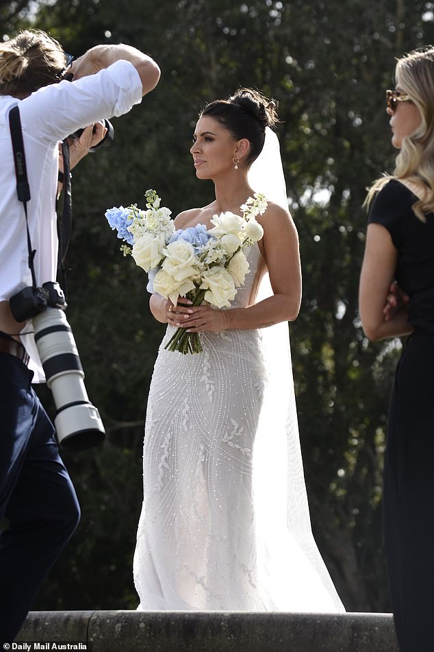 She showed off her stunning features with a very glamorous makeup palette as she posed for her beautiful wedding day portraits