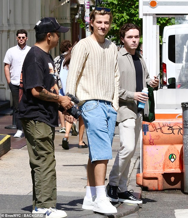 During the weekend outing, Millie walked down a busy sidewalk as she delivered one of the refreshing coffee drinks to her husband Jake, who was busy filming a project in the Big Apple