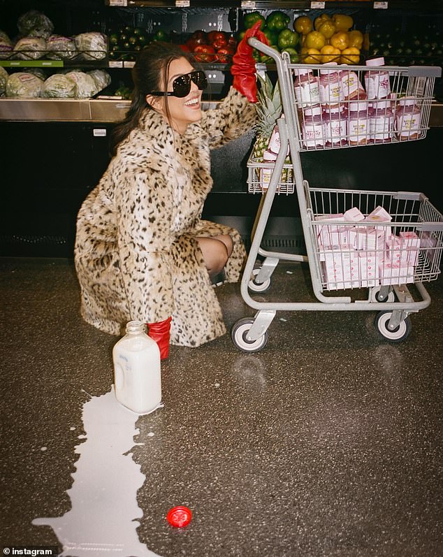 In the vintage-looking snaps, the Los Angeles native pushed a shopping cart through the grocery store filled with her Lemme brand supplements