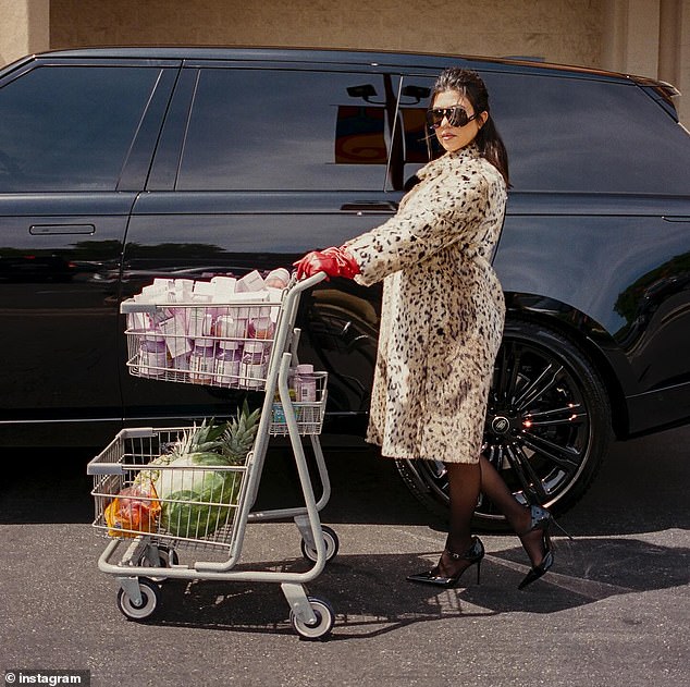 In other snaps, we see the reality star carrying her cart full of her supplements and fruit to her car