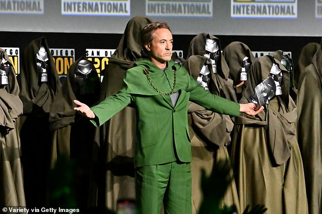 Downey Jr. made his entrance at the convention in a Doom costume, surrounded by replica Doombots, before removing his silver mask to reveal his face