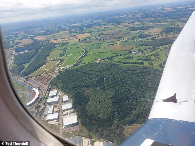 Ted flies over the Silverstone Circuit (above, bottom left) on his way to Oxford and back