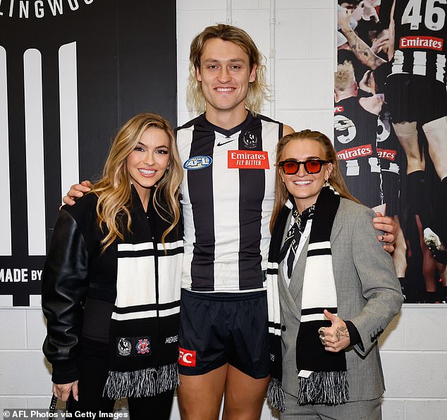 The couple had big smiles on their faces as they posed up a storm with football stars Isaac Quaynor, Darcy Moore and Mason Cox ahead of their match against Richmond. Pictured with Darcy Moore