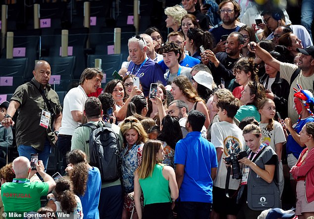 The Top Gun actor beamed for selfies with fans in the arena