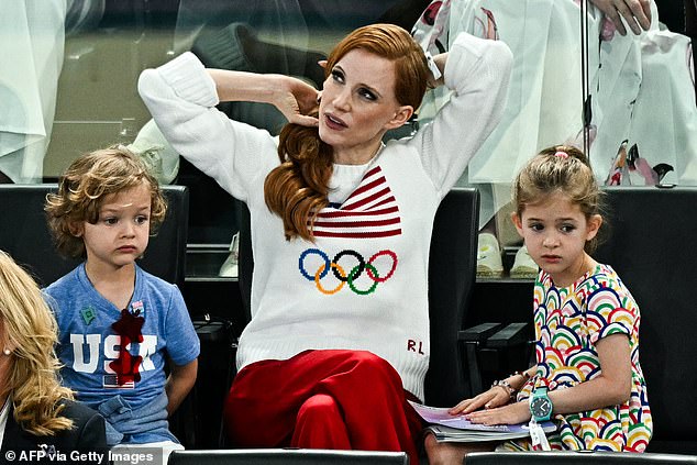 To show her support for her native USA, she wore a white jersey with the American flag and Olympic rings on it.