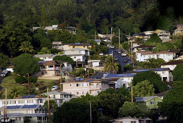 As for the state's housing market, it has become increasingly difficult to keep up with the influx of residents, not to mention the many tourists who travel there. (Pictured: A neighborhood of single-family homes in Honolulu)