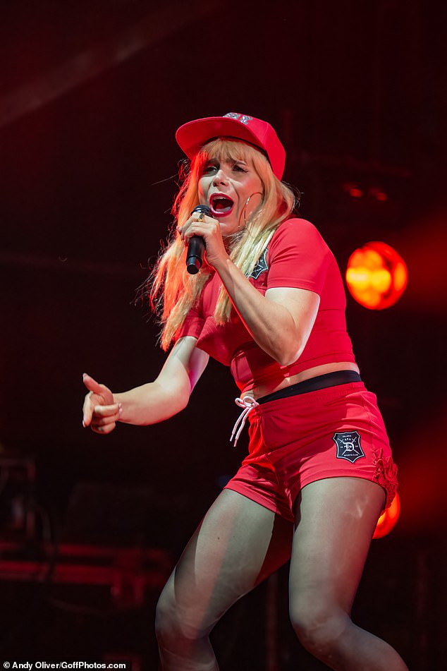 Paloma showed off her sensational figure for the performance in a pair of tiny red shorts and a matching red T-shirt that hugged her petite frame and showed off a glimpse of her waist