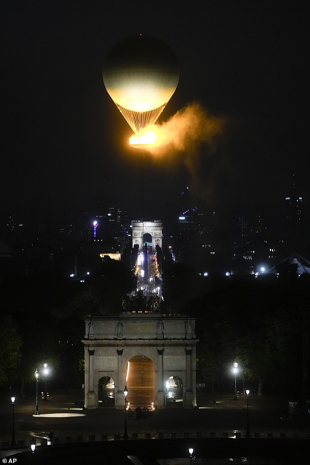 The balloon rises into the night sky over Paris on Friday evening