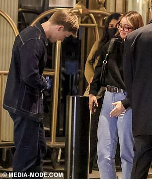 The couple displayed a flirty display as they chatted in the hotel lobby